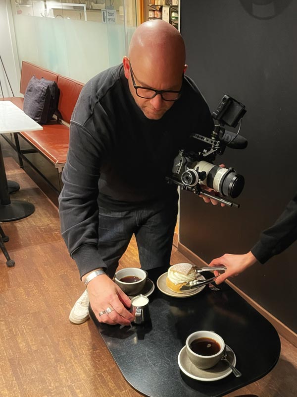 Filming at a café table