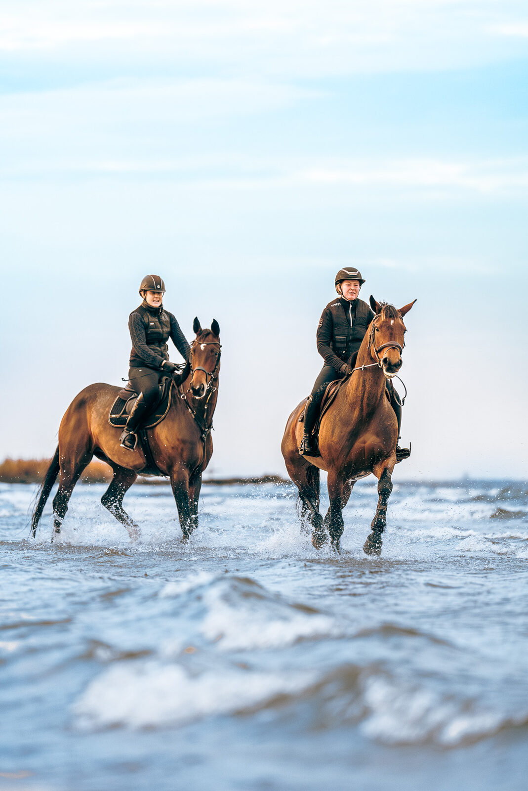 Two riders in the shallows